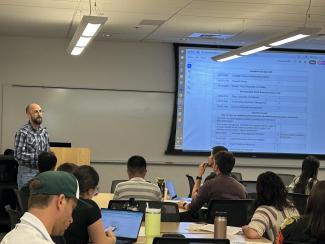 Dr. Thomas Duster speaks to the new graduate students