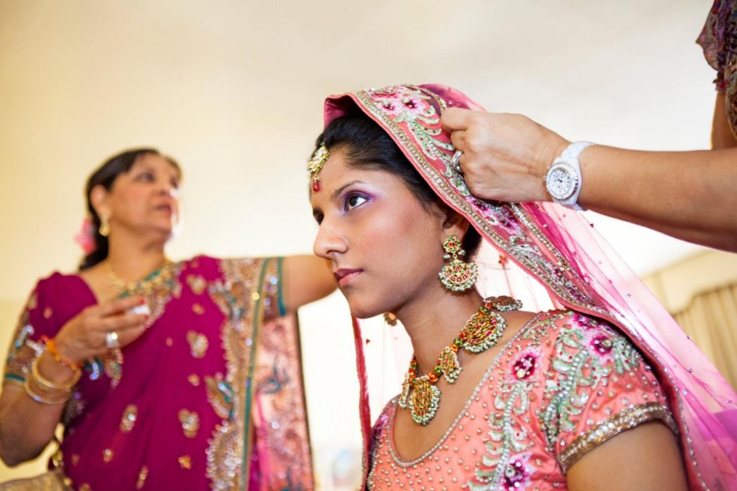 portrait of woman putting on a dupatta