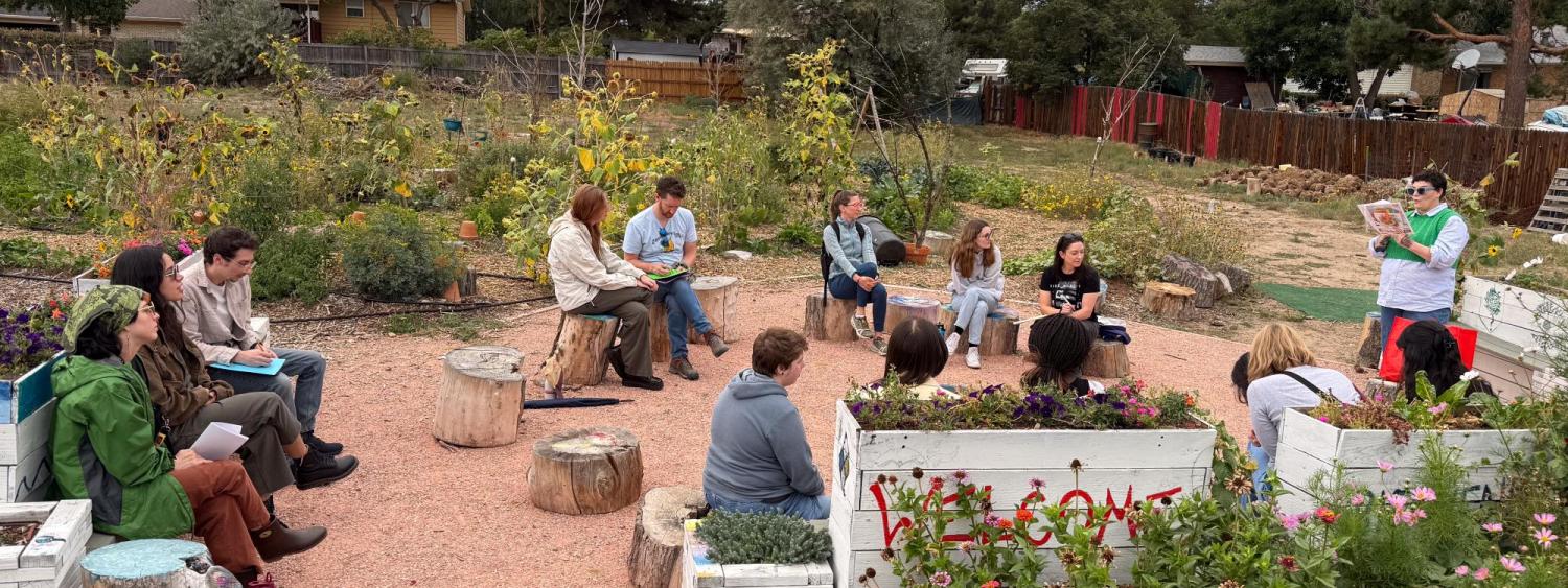 students presenting in garden