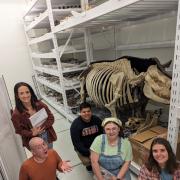 5 students at the Denver Museum of Nature and Science with fossils