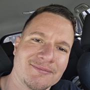David taking a selfie in a car