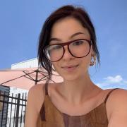 Haley sitting outside with glasses on