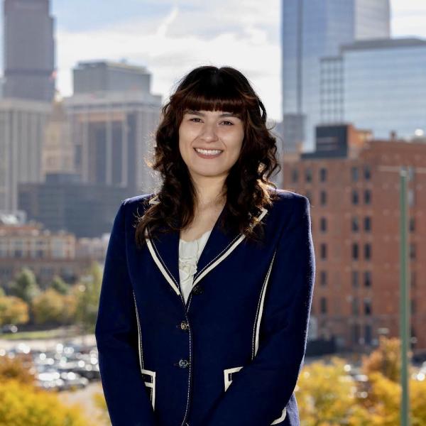 Head shot of Valerie Ortega with Denver as the background.