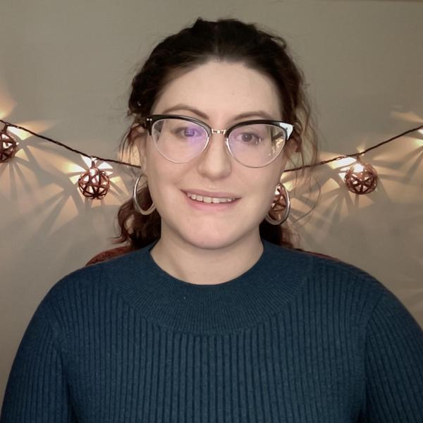 Head shot of Anne, Glasses, Blue Shirt