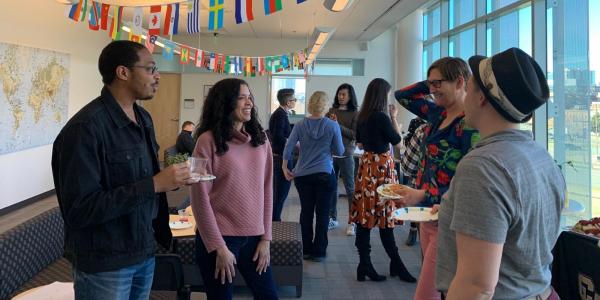 COMM faculty chatting at a book event