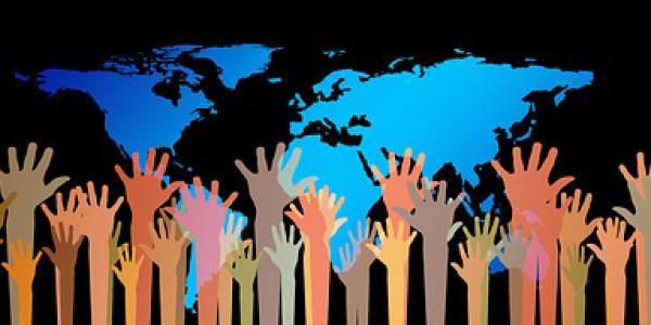 global diversity image with multicolored hands reaching up