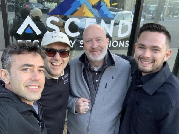  UCD PEP Director Hartnett, Associate Vice Chancellor for Academic Affairs Hamilton Hamilton Bean, program alumni Jacob Carlock and Geordan Morris. Pictured in front of their company, Ascend Peer Recovery
