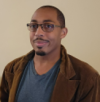 An African American man with glasses. 