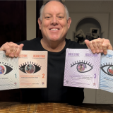Dr. Otañez holding four books