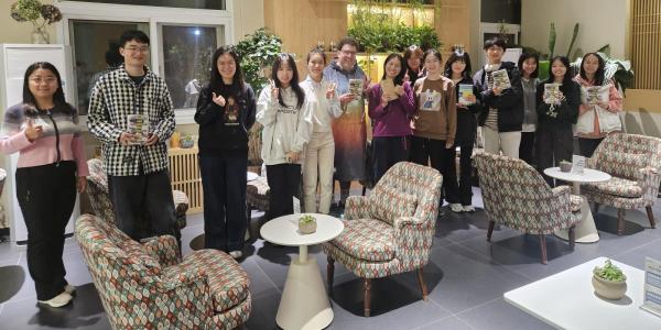 students and faculty participate in a book club in Beijing, China