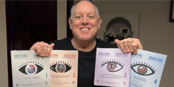 Dr. Otañez holding four books