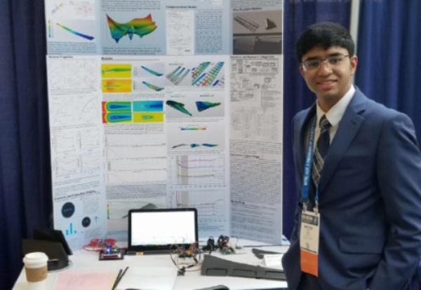Krithik Remesh with poster board at 2018 ISEF Competition