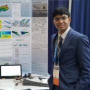 Krithik Remesh with poster board at 2018 ISEF Competition 