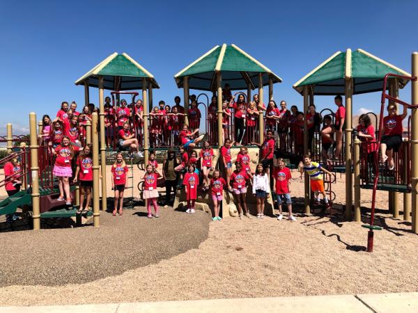 Group of campers posed on a playground