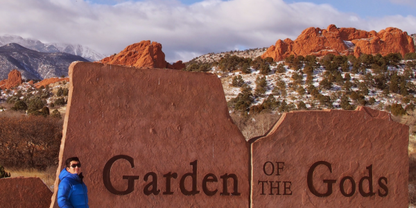 Example of an informative image - Chemistry Professor standing near the Garden of the Gods park sign.