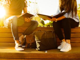 Two students with notebooks