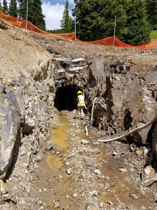 Student working at a mine adit