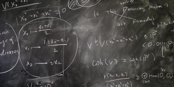 Photo of chalkboard with mathematical expressions on it