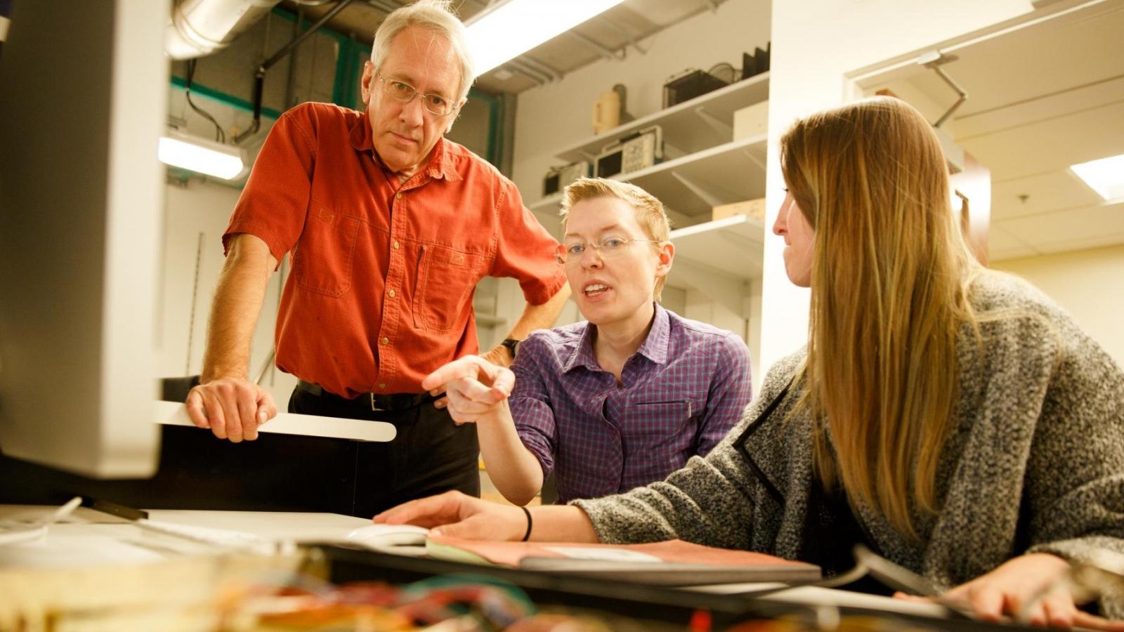 Photo of Professor Martin Huber from Physics with students.