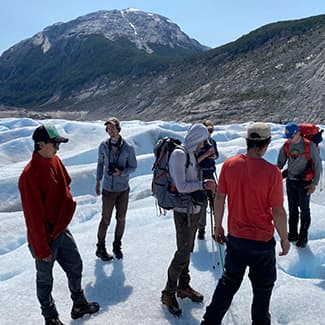 CU Denver students on a snowfield in Patagonia