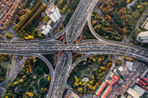 Aerial view of a intricate highway infrastructure of a dense urban landscape in a major city.