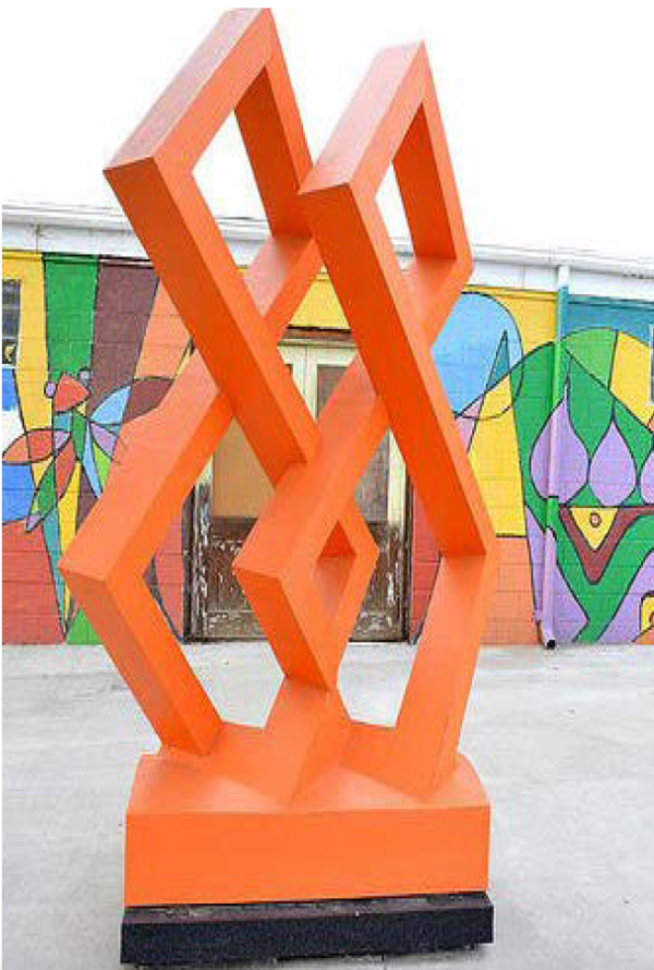 An abstract art installation of an orange sculpture of four interlocking squares, near the height of an adult human.