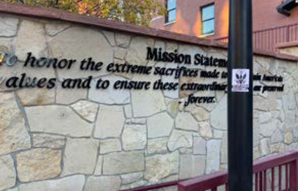 A stone wall with the Center for American Values mission statement.