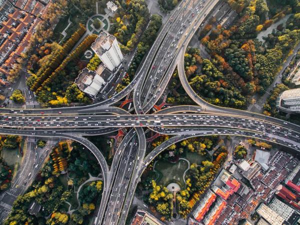 Aerial view of a intricate highway infrastructure of a dense urban landscape in a major city.
