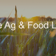 Sunlit field of green crops at golden hour with text “The Ag & Food Lab” overlayed.