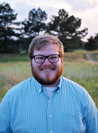 Travis Kelly's Headshot