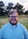 Travis Kelly's Headshot