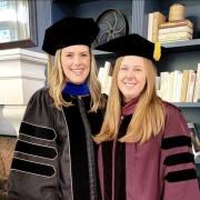 Photo of Sydney Jane and Krista in graduation robes