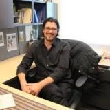 picture of Ryan Crewe seated at desk