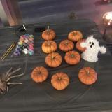 Photo of the pumpkin painting table at the Phi Alpha Theta Halloween event