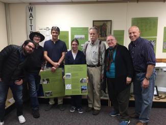 History students pose with Dr. Hunt in front of the new exhibit 