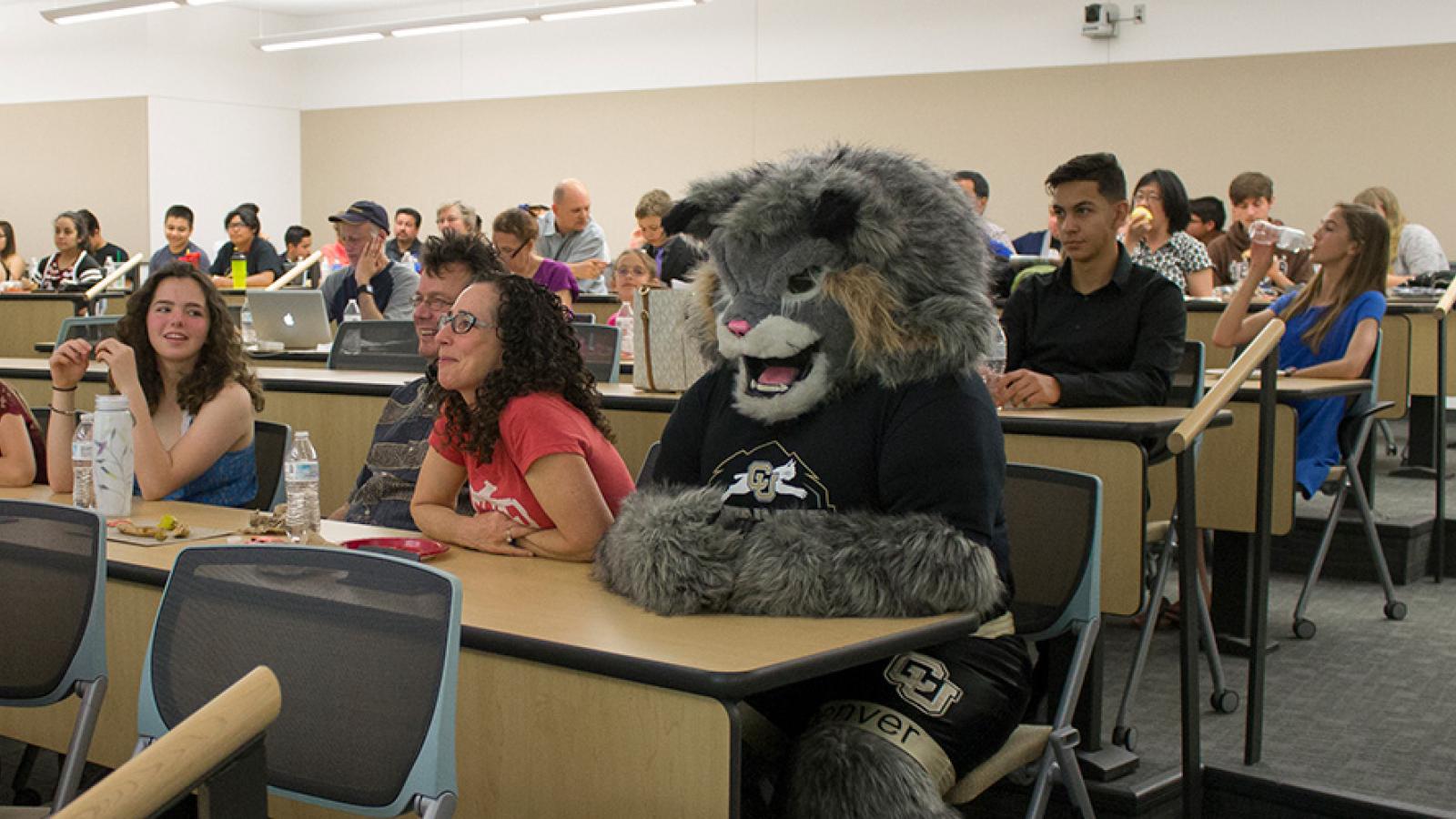 students in class with mascot Milo the Lynx