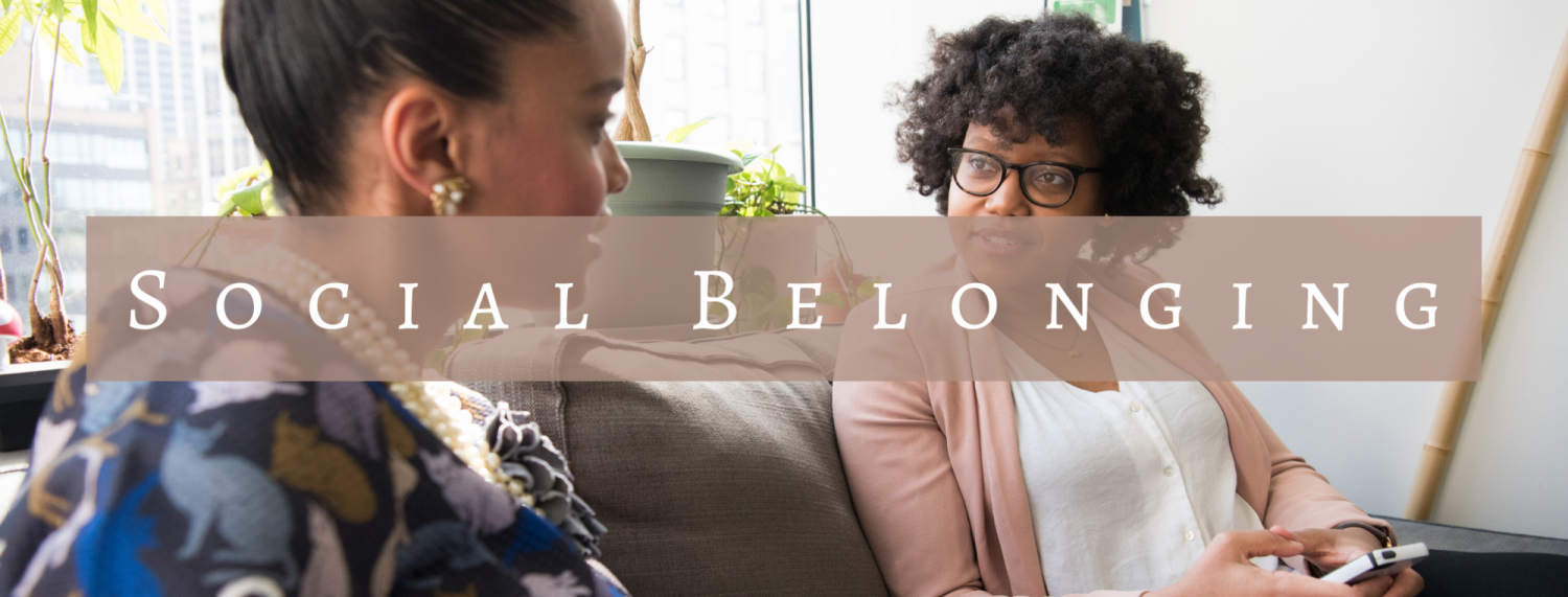 Social Belonging Header. Photo shows two women talking who are sitting next to each other.