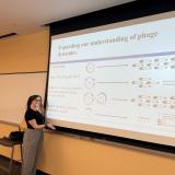 Grad student Jillyn Tittle presenting her PhD proposal on a classroom projector.