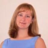 Headshot of Laurel Hartley wearing a light blue sleeveless shirt