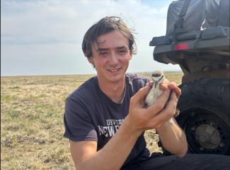 Alexander holding a bird