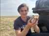 Alexander holding a bird
