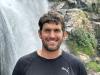 David standing near a waterfall