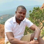 Jerome sitting on a rock