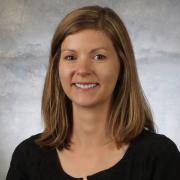 Head shot of Emily who has shoulder length blonde hair