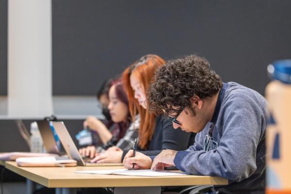 Students taking notes in class