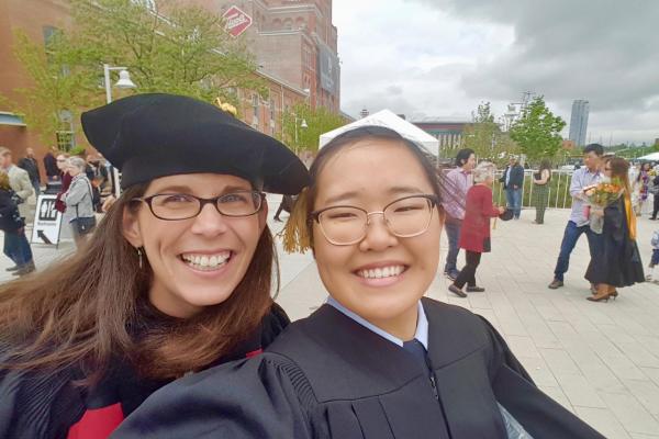 Dr. Mosier celebrating with graduating student researcher
