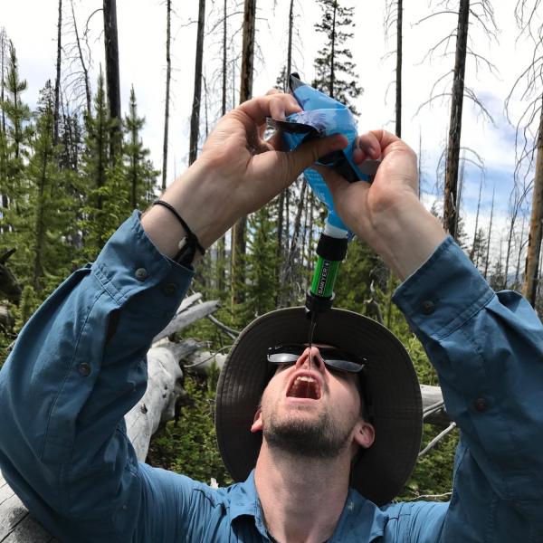 Researcher drinking water