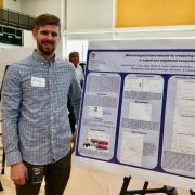 Student Mike Kain presenting poster