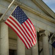 Close up of government building with the US flag.