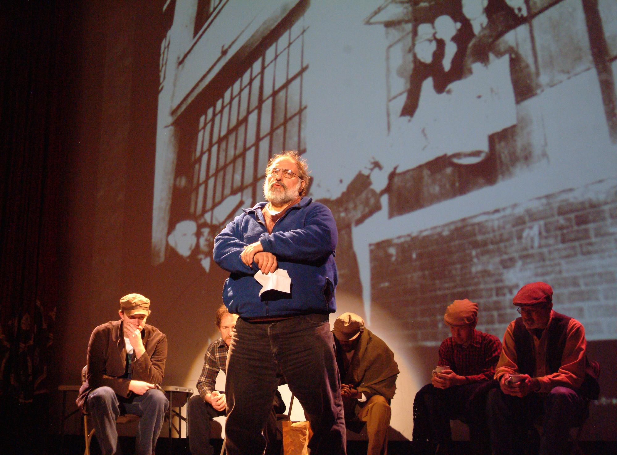 Romero Troupe actor monologues on stage